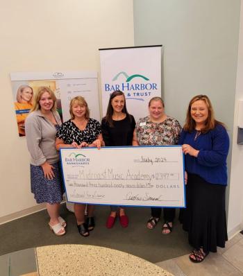 Bar Harbor Bank & Trust (BHBT) presents a donation from the Bank’s Casual for a Cause program to Midcoast Music Academy. Pictured from left to right: Dasha Schlicker, Customer Service Representative at BHBT; Lisa Veazie, SVP Regional Market Manager at BHBT; Alison Applegate, AVP Community Banking Relationship Manager at BHBT; Hazel Young, AVP Branch Relationship Manager at BHBT; and Jennifer Feldman, Executive Director at Midcoast Music Academy. (Photo courtesy BHBT)