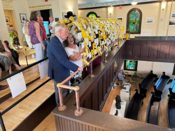 Maine Senator Angus King tours the exhibit with Camille Davidson. (Photo courtesy Jordan Cohen)