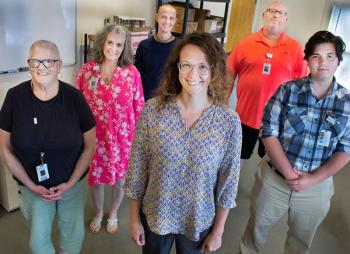 Pen Bay and Waldo Community Health Workers: Front row, from left: Fran Butler; Breanne Bucka; and Quinn Pickett. Middle row, from left: Melissa Crowley and Richard “Dick” Morin. Back row: Adi Govinda Dasa. (Photo courtesy MaineHealth)