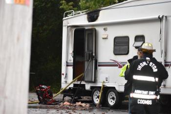 A newly acquired camper parked in a driveway caught fire Thursday evening. (Photo by Sarah Thompson)
