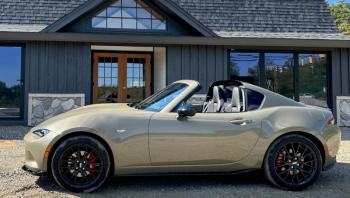 Mazda’s front-engine, rear-drive MX-5, aka the Miata, is only six feet shorter than a GMC Yukon XL, but it looks like it might fit on the SUV’s roof rack. There’s ample space and comfort for two adult humans, but pack light—the folding hard top fills the trunk. This color is Zircon Sand Metallic.