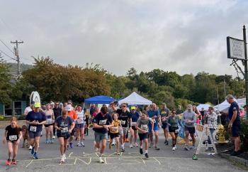 Runners and walkers put an energetic start to Windjammer Festival Day 2 at the Camden Public Landing with the annual Camden Fire Dept. Family Fun 5K. The course took them Bay View and Chestnut streets in Camden, and back to the harbor. (Photo by Lynda Clancy)