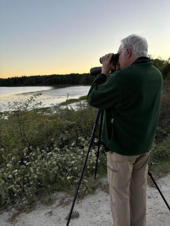 Co-author Jeff Wells taking in views of shorebirds and other birds at Wolfe’s Neck Center in Freeport. Courtesy of Allison Wells #bird-column, #shorebirds, #Wolfe’s Neck Center, #Freeport, #Maine, #Jeff and Allison Wells, #birds