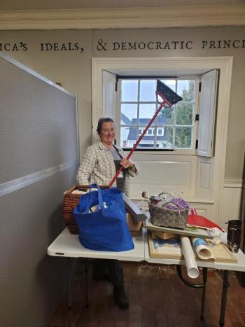 Noreen Mullaney, along with other volunteers, cleans the lower level of the Knox Museum during 2023's Together for Thomaston Event. (Photo by Kendray Rodriguez)