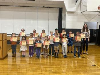 Kindness Award Winners: Front: Ryleigh Gagnon, Adelaide Walsh, Noa Stevenson, Jaxon Gage, Vivien Hedstrom, Matthew Hawkins, Trenton Adams. Back: Lorelei Walsh, Juliette Johnson, Evelyn Fish, Essie Ross, Justin Chen, Wyatt Earley, Derrick Corson, Wyatt Hendron, Principal Ainslee Riley.