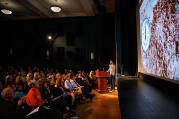 Aaron Englander presents at the April 2024 Pecha Kucha Night at the Strand Theatre. (Photo by Michael O’Neil)
