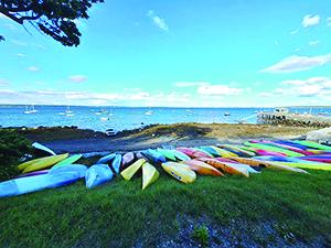 Kayaks lay shore at the Temple Heights beach.  (Photo by Erica Thoms)