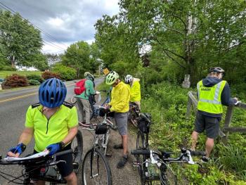 A group of cyclists jot down observations and ideas earlier this year while doing a handlebar survey of Belfast roads. Input from the cyclists, along with walkers, wheelchair users, and others, will become part of a roadmap for the city to improve its pedestrian and bicycle transportation network. (Photo courtesy City of Belfast)