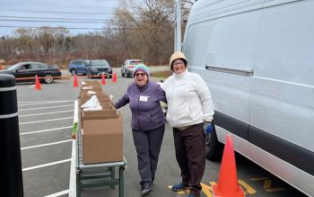 Volunteers help lighten the load. Photo courtesy Alan Kearl