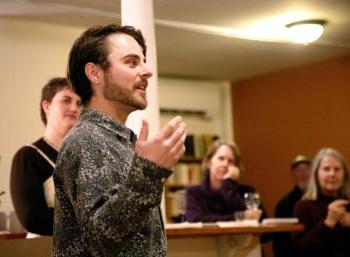 Artistic Director Tucker Atwood (front) announces the 2025 Belfast Maskers' season at an annual meeting of volunteers. (back, l-r: Angelina Nichols, Andrea Butler, Mike Nickerson, Julia Olson. (Photo by Gwyneth Sauvage.)