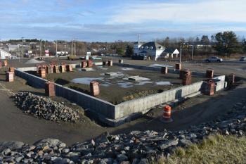 Foundation and underground infrastructure are growing at 198 Old County Road, in Thomaston. The proposal, now two years old, states that Starbucks wishes to fill one of the suites. (Photo by Sarah Thompson)