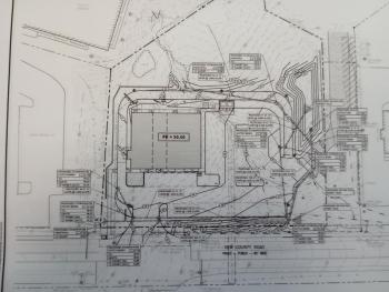 Application paperwork shows the site location.