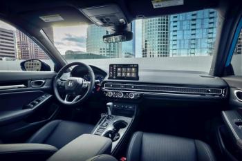 The front office of the Civic manages to be both compact and spacious, with attractive honeycomb and carbon fiber-look panels. The infotainment screen offers haptic feedback—the touchpads move slightly—but there are conventional switches and knobs on the console too. Honda Civic Interior