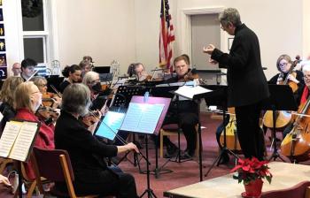 Conductor Deirdre McClure conducts orchestra. (Photo courtesy Penobscot Bay Orchestra)
