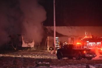 Firefighters focused on two fire scenes after flames from a camper fire spread. (Photo by Sarah Thompson)