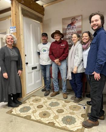 Midcoast Habitat for Humanity staff and volunteers stand in front of the memorial door honoring former President Jimmy Carter’s work with Habitat for Humanity. (L-R) Tia Anderson, Todd Look, Bob Newbest, Kristie Kosalski, Maggi Blue, and Dashiell Marley. (Photo courtesy Midcoast Habitat for Humanity)