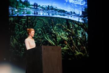 Allison McKellar presents at the November 2024 PechaKucha Night at the Camden Opera House. (Photo by Michael O’Neil)