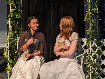 Charlotte Bronte, played by Dilyla Brown, sits with Emily Bronte, played by Morgan Cornell. (Photo courtesy Searsport District High School)
