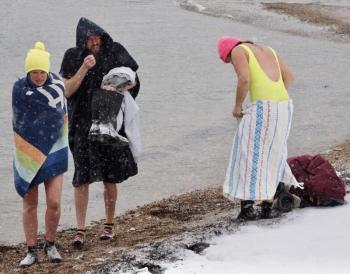 Snow Moon Selkies’ 9 a.m. dip at Naskeag Point in Brooklin was the height of Sunday’s storm. Sarah Havener on the left by Monday had raised $1,600 for Finding Our Voices. (Photo by Michael Percy) Snow Moon Selkies’ 9 a.m. dip at Naskeag Point in Brooklin was the height of Sunday’s storm. Sarah Havener on the left by Monday had raised $1,600 for Finding Our Voices. (Photo by Michael Percy)