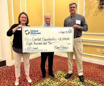 L - R: Becca Gildred-UMC Executive Director, Jim Hengerer-UMC Board Chair, and Cliff Winn-Executive Director of Coastal Opportunities. (Photo courtesy United Midcoast Charities)