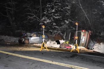 Fire Dept. headlamps illuminate the scene of a two-vehicle crash in Washington. (Photo by Sarah Thompson)