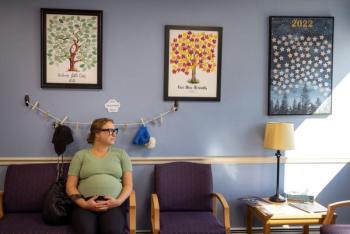 Rachel Keidan sitting in a waiting room.