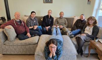 The cast of "Becky's New Car" by Steven Dietz take a break during a read-through of the play in January. Front: Katie Glessner; Back, l-r: Rob Bywater, Tom Lott, Eric Sanders, Mark Durbin, Giz Coughlin, Courtney Hawkins. (Photo courtesy Belfast Maskers)