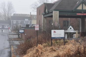 Looking toward Limerock Street at the healthcare signs for 6 White Street (foreground) and 4 White Street in the rear. (Photo by Sarah Thompson)