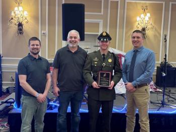 Maine Marine Patrol Specialist Dan Vogel (second from right) receives the 2025 Maine Lobstermen’s Association Officer of the Year Award during the Fishermen’s Forum. Pictured with Specialist Vogel are Deer Isle lobsterman and MLA Board Member Brian Billings (left), Beals Island lobsterman and MLA Board Vice Chairman Sonny Beal (2nd from left), and Marine Patrol Colonel Matt Talbot Beal (right). (Photo courtesy Department of Marine Resources) Maine Marine Patrol Specialist Dan Vogel (second from right) receives the 2025 Maine Lobstermen’s Association Officer of the Year Award during the Fishermen’s Forum. Pictured with Specialist Vogel are Deer Isle lobsterman and MLA Board Member Brian Billings (left), Beals Island lobsterman and MLA Board Vice Chairman Sonny Beal (2nd from left), and Marine Patrol Colonel Matt Talbot Beal (right). (Photo courtesy Department of Marine Resources)