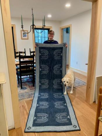 Sarah Leighton and an example of her hooked rug art. (Photo courtesy Rockport Public Library)