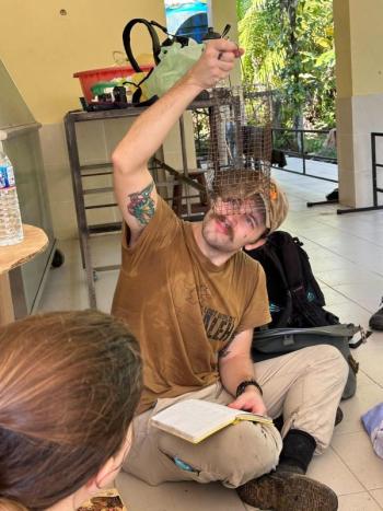Eric Brown checks out a recently-acquired squirrel. (Photo courtesy Merryspring Nature Center)