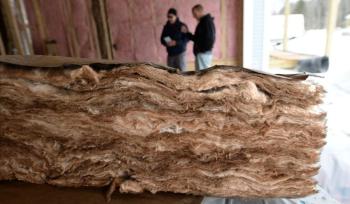 Batts of fiberglass insulation of various thicknesses are being used at The Cottages at Winding Ridge subdivision in Gorham to meet heat loss specifications. Photo by Fred J. Field. fiberglass insulation