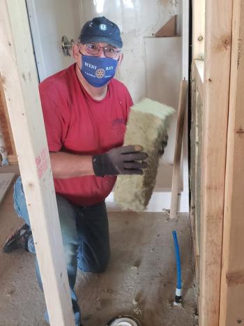 Rotarians regularly contribute to Habitat efforts, improving the energy efficiency of existing spaces. (Photo courtesy Midcoast Habitat for Humanity) Rotarians regularly contribute to Habitat efforts, improving the energy efficiency of existing spaces. (Photo courtesy Midcoast Habitat for Humanity)