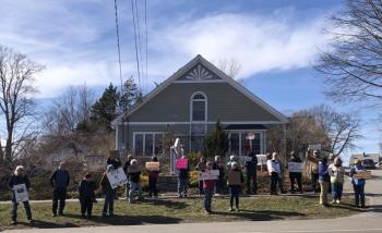 a crowd of library supporters in front of the Waldoboro Public Libraryy
