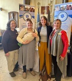 Healthy Kids' educators Toby Lecrone (Knox), Sofie Watts (Lincoln) and Executive Director Char Corbett (right) stand with Rep. Lydia Crafts at the State House Hall of Flags on April 2 to kick off Child Abuse Prevention Month with the state’s Prevention Councils. (Photo courtesy Healthy Kids)