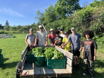 L-R: Erickson Fields Farm Manager Carrie O’Brien, Erickson Fields Farm Hand Connor Palatucci, and the 2025 Summer Teen Ag Crew: Cole Thompson, Taio Widdicombe, Jude Wight, Huy Nguyen, Oliver Wight, Dakota Sanders. (Photo courtesy MCHT