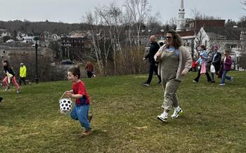 They were off and running, more than 200 children, chasing down the eggs April 19 at a community Easter Egg Hunt in Camden. (Photo by Lynda Clancy) c