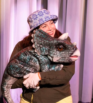 Joanna Clark (aka Jurassic Jo) and dino pal. (Photo courtesy Strand Theatre)