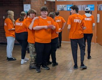 Runners ready to deliver problems to the floor. (Photo by Elias Twitchell)