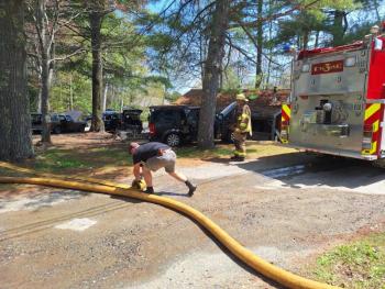 (Photo by Sarah Shepherd) Rolling hose