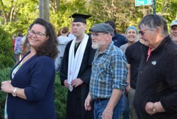 Kim Graffam, Leni Gronros and Donna Gronros, parents and grandmother of a graduate, enter the First Congregational Church for the baccalaureate service. (Photo by Lynda Clancy) c