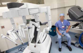 Nathan Elwood, MD, a surgeon at MaineHealth Pen Bay and the new surgical robot. (Photo courtesy MaineHealth)