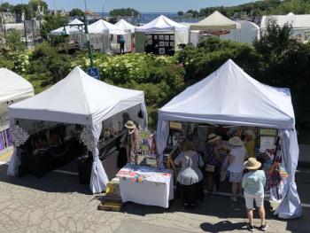 Artist tents set up for The Harbor Arts and Books Fair overlooking Camden Harbor. (Photo by Camden Public Library Staff)