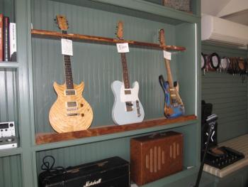 Guitars for sale at String Theory. Photo by Kay Stephens