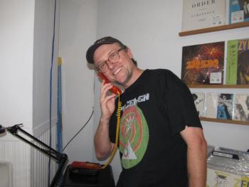 Justin Miller still has vinyl records and a landline. Photo by Kay Stephens