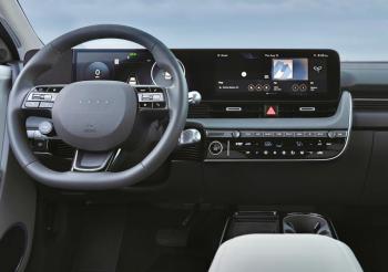 Improvements to the Ioniq 5 for 2025 include physical buttons for often-used functions and next-generation connectivity and electronics. The touchscreen can be configured to show battery charge and mileage as well as the location of the nearest charging station. The lower of the two knobs behind the steering wheel is the gear selector. Improvements to the Ioniq 5 for 2025 include physical buttons for often-used functions and next-generation connectivity and electronics. The touchscreen can be configured to show battery charge and mileage as well as the location of the nearest charging station. The lower of the two knobs behind the steering wheel is the gear selector.