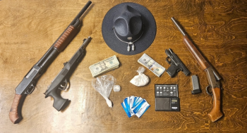 Pictured are the drugs, weapons, and cash collected from the residence. Image courtesy of Maine State Police.