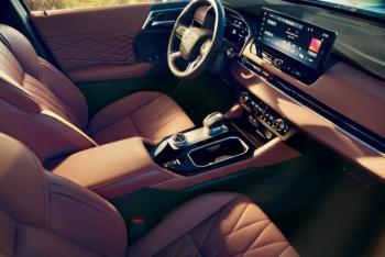 For 2025 the Outlander’s cabin was upgraded with premium-looking upholstery and other materials along with this 12.3-inch touchscreen. The satisfyingly mechanical-feeling push-pull gear selector has the Park button on top, and the e-brake switch is right there on the center console. The knob next to the drink-holder cubby is the drive-mode selector. For 2025 the Outlander’s cabin was upgraded with premium-looking upholstery and other materials along with this 12.3-inch touchscreen. The satisfyingly mechanical-feeling push-pull gear selector has the Park button on top, and the e-brake switch is right there on the center console. The knob next to the drink-holder cubby is the drive-mode selector.