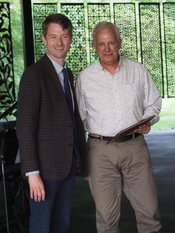 PAWS Executive Director Casey Baugher and Alvin Chase of Eastern Tire. (Photo courtesy PAWS Animal Adoption Center)