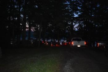 A narrow camp road is illuminated by taillights at 4:15 a.m. (Photo by Sarah Thompson)